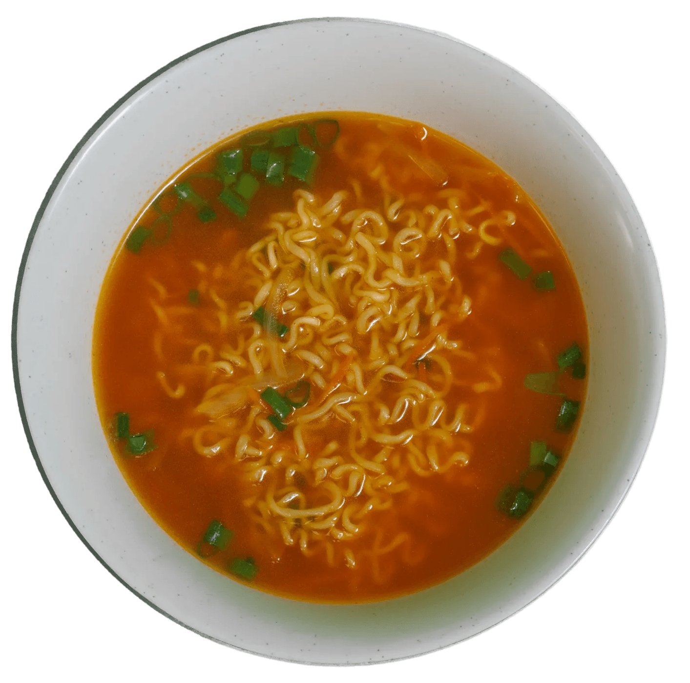 Two upright wraps, sliced diagonally to showcase fillings of white meat, purple cabbage, shredded carrots, creamy white sauce, and fresh green herbs, topped with red spice.