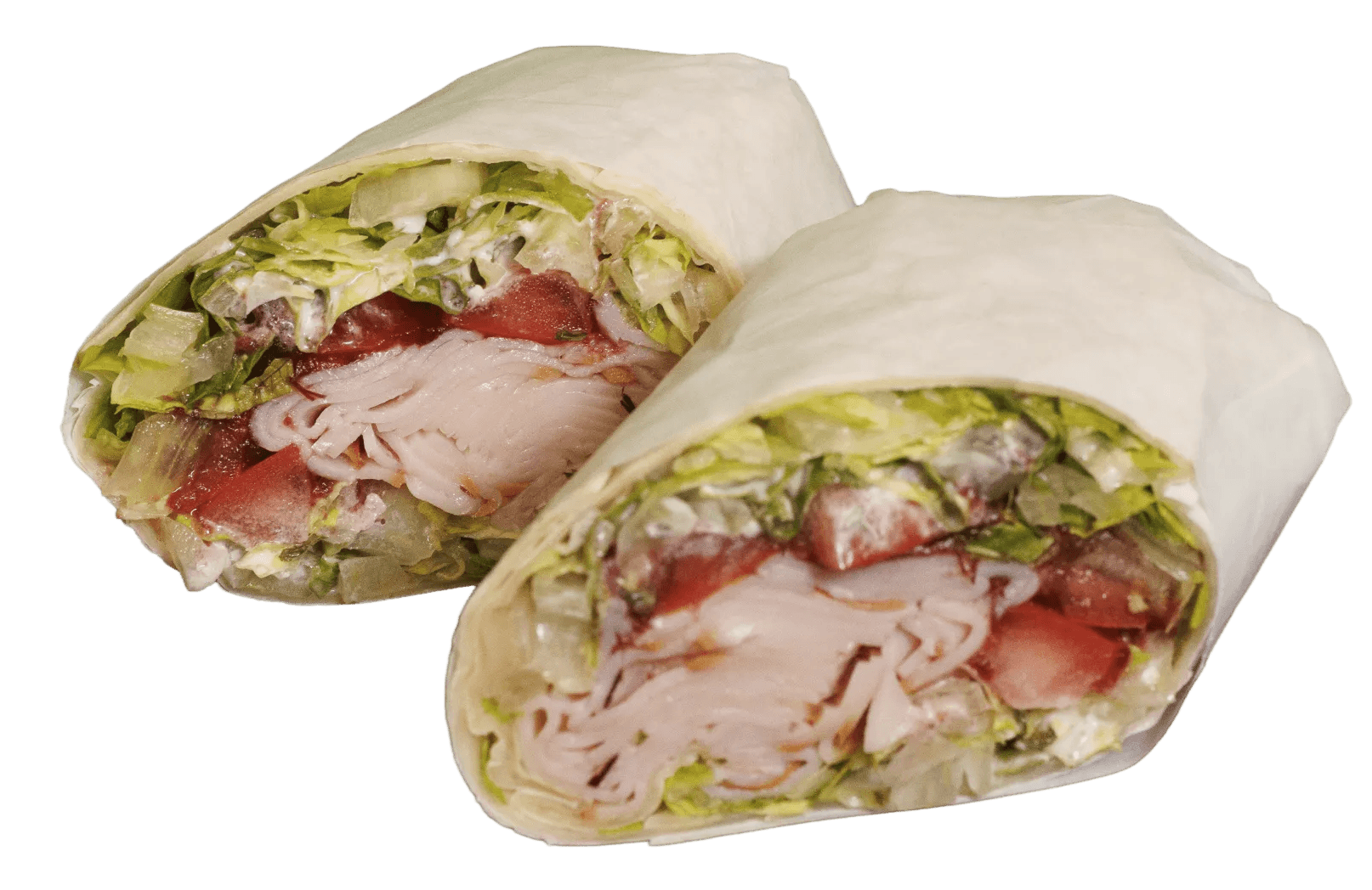 Two wraps, cut in half and standing upright, revealing fillings of chicken, red cabbage, shredded carrots, creamy sauce, fresh green herbs, and a dusting of red spice.